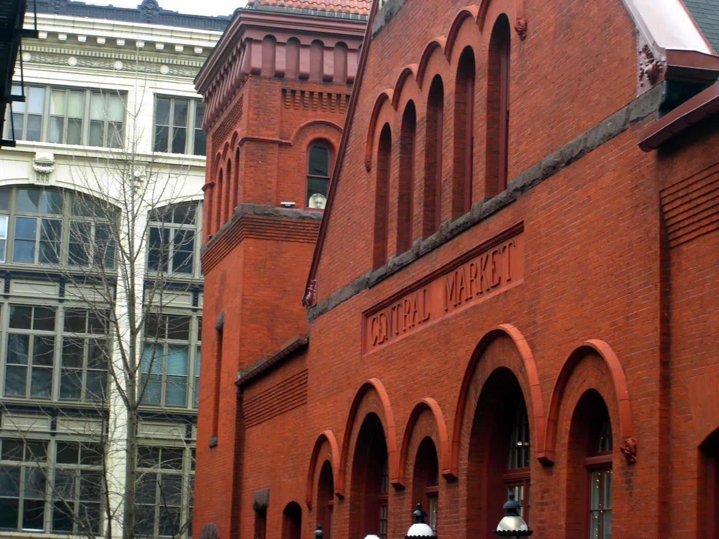 Red-brick arches and the Central Market sign on the historic market building in downtown Lancaster.